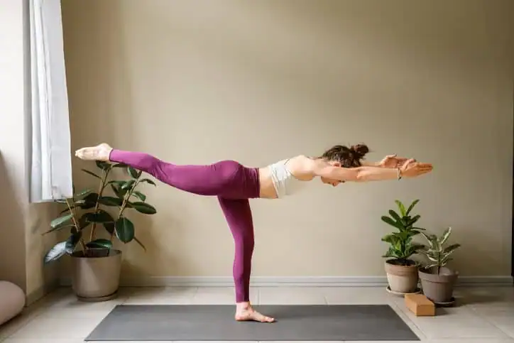 Achieving the Perfect Tone: How Often Should You Exercise for Results? 1 Woman doing Yoga exercise Rochester to help with toning the body.