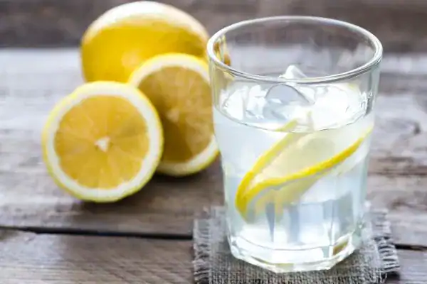 Hydration: The Secret Ingredient for a Toned Stomach and Enhanced Fitness 2 Image of lemon water to aid hydration Rochester